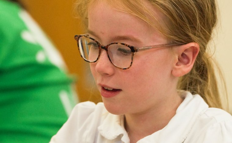 A child taking part in an activity at a uKids after-school club